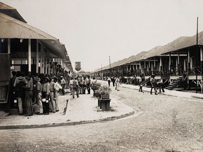 Workers queue up at the outdoor kitchen at Camp Bierd barracks, Cristóbal.